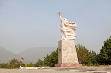 Tirana, Albania - April 24 2019: The Mother Albania statue is located at the National Martyrs Cemetery of Albania. It figuratively represents the country as a mother guarding over the eternal slumber of tho