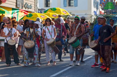 Saint-Gilles les bains, La Reunion - June 25 2017: Group of percussionists playing with their djembe during the carnival of the Grand Boucan.