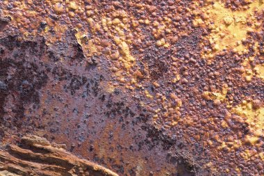 Full frame close-up on a rusty iron plate.