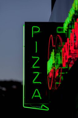 Close-up on a white neon light shaped into the word 