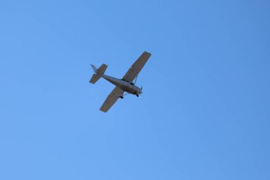 A white Reims-Cessna F172P Skyhawk II in mid air.