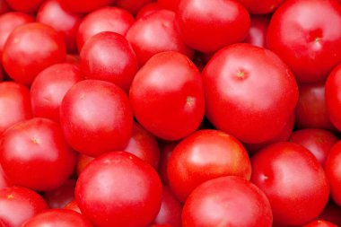 Close-up on a stack of tomatoes (Tatar of Mongolistan) for sale on a market stall.