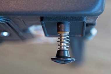 Close-up on a pull lever of a vintage pinball machine.