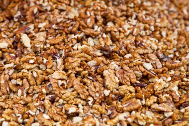 Close-up on a stack of Walnut kernels for sale on a market stall.