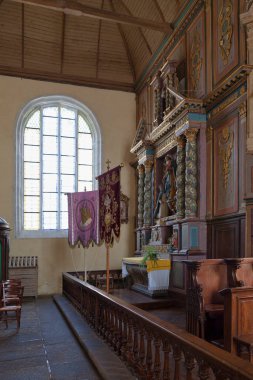 The altar of the Rosary is a retable at the church of Notre-Dame-et-Saint-Tugen of Brasparts in Finistere, Brittany.