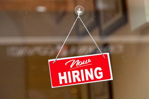 Red Sign Hanging Glass Door Shop Saying Now Hiring — Stock Photo, Image