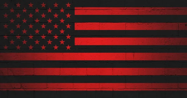 Picture of the red and black American Anarchist Flag painted on a cinder block wall