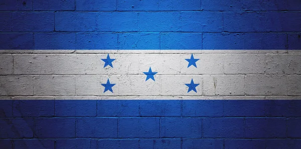 洪都拉斯国旗画在煤渣砌墙上 — 图库照片
