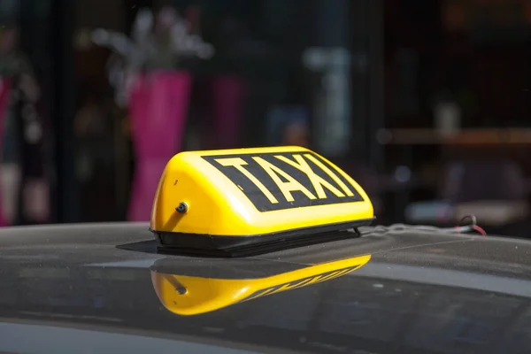 stock image Close-up on a yellow Austrian taxi sign from Vienna.