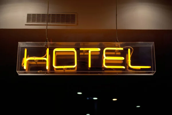 Yellow Neon Light Shaped Word Hotel — Stock Photo, Image