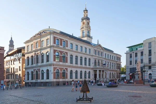 stock image Riga, Latvia - June 13 2019: The Riga Town Hall in the old town opposite the statue of Saint Roland and the House of Blackheads.