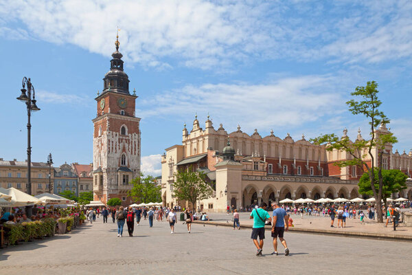 Krakow, Poland - June 07 2019: The Main Square with the Cloth Hall and the free-standing Town Hall Tower.