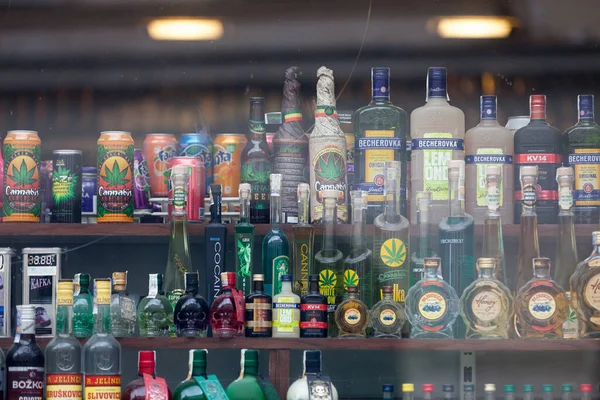 stock image Prague, Czech Republic - June 14 2018: Small shop displaying for sale many bottles of alcohol, including many of them brewed with Cannabis.