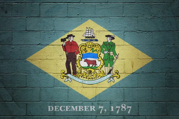 Bir Tuğla Duvara Delaware Bayrağı Boyanmış — Stok fotoğraf