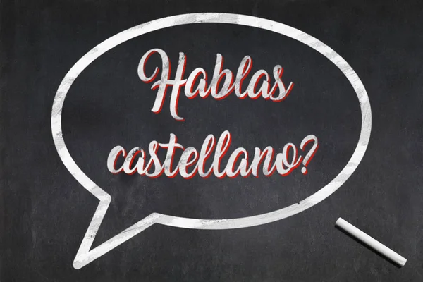カスティーリャの短いフレーズと真ん中に描かれたバブルのブラックボード ハブラスカルダノ あなたはカスティーリャ語を話しますか という意味 — ストック写真