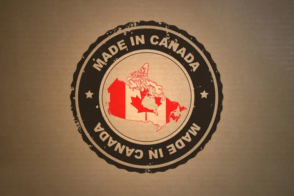 カナダ製のレトロスタイルのスタンプの中央にあるブラウンペーパーには カナダの地図と旗が含まれています — ストック写真