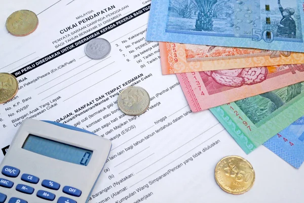 Калькулятор Деякі Монети Банкноти Рінггіт Вершині Малайзійської Форми Податку Прибуток — стокове фото