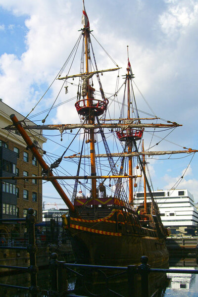 London, United Kingdom - August 02, 2005: Tourists visiting the Golden Hinde II, a replica of Sir Francis Drake's ship from 16th century. It's located on Clink Street, opposite to The Old Thameside Inn.