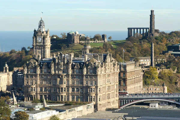 stock image Edinburgh, Scotland - November 02 2006: View of the Balmoral, the Waverley railway station and the North Bridge with behind them, on Calton Hill: the City Observatory, the Nelson Monument, the Dugald Stewart Monument and other landmarks