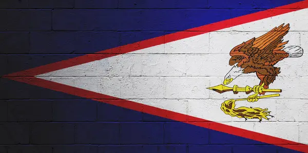 Flag of the American Samoa painted on a cinder block wall.