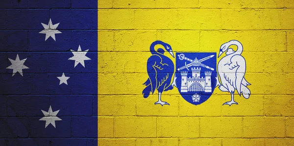 Flag of Australian Capital Territory painted on a cinder block wall.