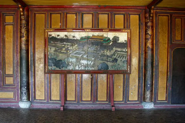 Centuries old painting in the old Imperial city in Hue depicting a scene from the Royal court.