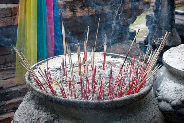 Incense burner in front of the recicling Buddha in Wat Lokaya Sutharam, Ayuthaya.