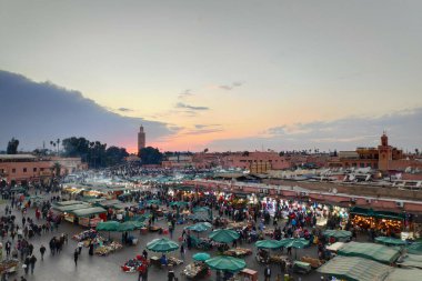 Marrakesh, Morocco - January 16 2018: Jemaa el-Fnaa is a square and market place in Marrakesh's medina quarter (old city). It remains the main square of Marrakesh, used by locals and tourists. clipart