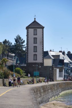 Saint-Malo, France - June 02 2020: The Bas-Sablons lighthouse is located on the quay of Bas-Sablons beach in the Saint-Servan district, a former municipality attached to the city of Saint-Malo, Ille-et-Vilaine (Brittany) clipart