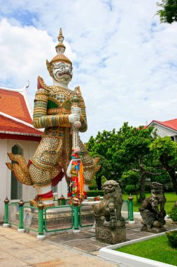 Yak (giant demon) garding the entrance at Wat Arun in Bangkok, Thailand. clipart