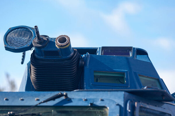 Close up on the machine gun and grenade launcher of an armored vehicle from the GBGM (Groupement blinde de gendarmerie mobile).