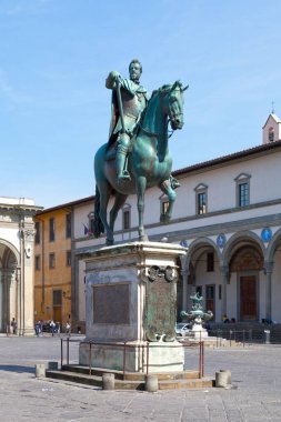 Florence, Italy - April 01 2019: The Equestrian Monument of Ferdinando I is a bronze equestrian statue by Giambologna erected in 1608 in the Piazza of the Annunziata. clipart