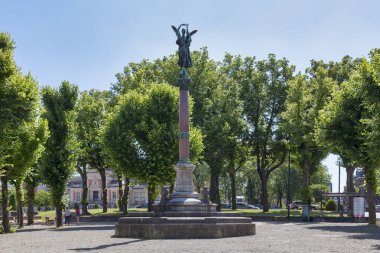 Valenciennes, France - June 22 2020: Statue of Victory (French: Statue de la Victoire) made by Gustave Crauk in 1864 then placed at the top of the defense column (French: Colonne de la defense) in 1902. clipart