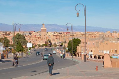 Ouarzazate, Morocco - January 30 2019: Masuda Wazzkaitih Mosque with the Atlas Mountains behind. clipart