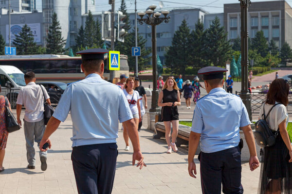 Ulan-Ude, Russia - July 29 2018: Two police officers patrolling the streets.