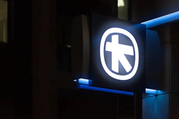 stock image Larnaca, Cyprus - March 07 2024: Illuminated sign at night of Alpha Bank, a private Greek bank.