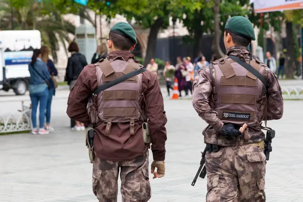 stock image Istanbul, Turkey - May 09 2019: Two soldiers of the special forces (Ozel harekat) patroling the street.