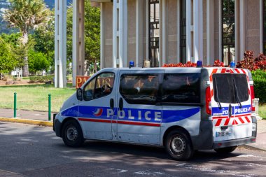 Saint-Denis, La Runion - June 27 2017: Police van parked outside of the Palais de Justice (Courthouse) located in the Avenue Andre Malraux. clipart