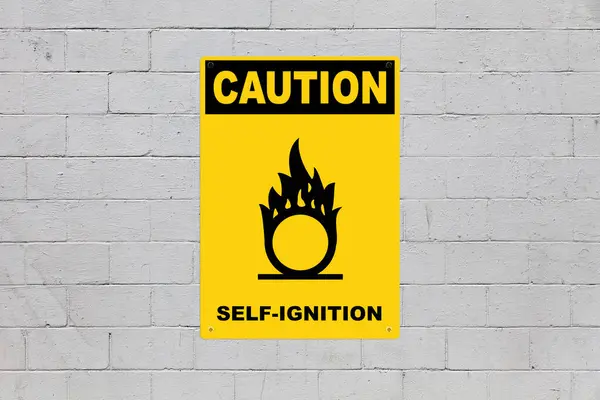 stock image Yellow warning sign screwed to a cinder block wall to warn about a threat. In the middle of the panel, there is a biohazard symbol and the message is saying 