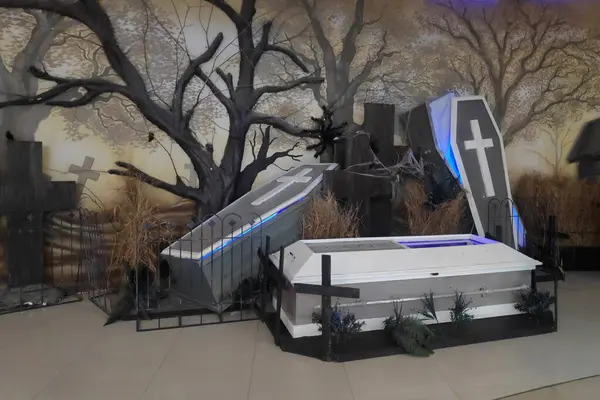 Coffins in a creepy cemetery decor during Halloween.