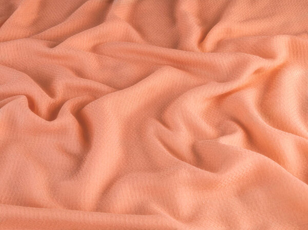 Peach textured fabric, color of the year 2024 Peach Fuzz background