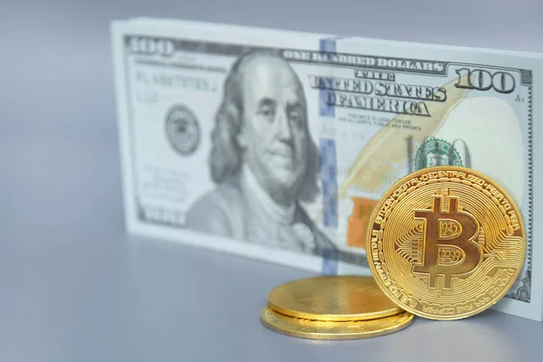 stock image Kharkiv, Ukraine - October 7, 2022: US Dollar and Digital money Bitcoin coin Put together. Concept of digital money is becoming a competitor in major currencies such as the dollar.