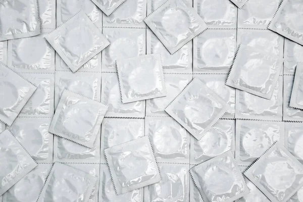 Many White Packages Unopened Condoms Background Using Condom Reduce Chance — Foto de Stock