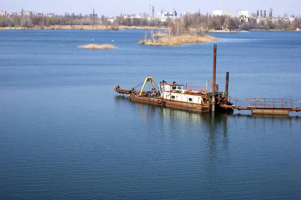 Large industrial pump for pumping sand from the bottom of the lake. Work on the extraction of sand in Ukraine.