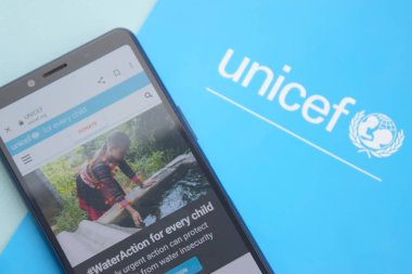 KHARKIV, UKRAINE - FEBRUARY 12, 2023: Unicef logo on the flyer. UNICEF is a United Nations program that provides humanitarian and developmental assistance to children and mothers in developing countries.