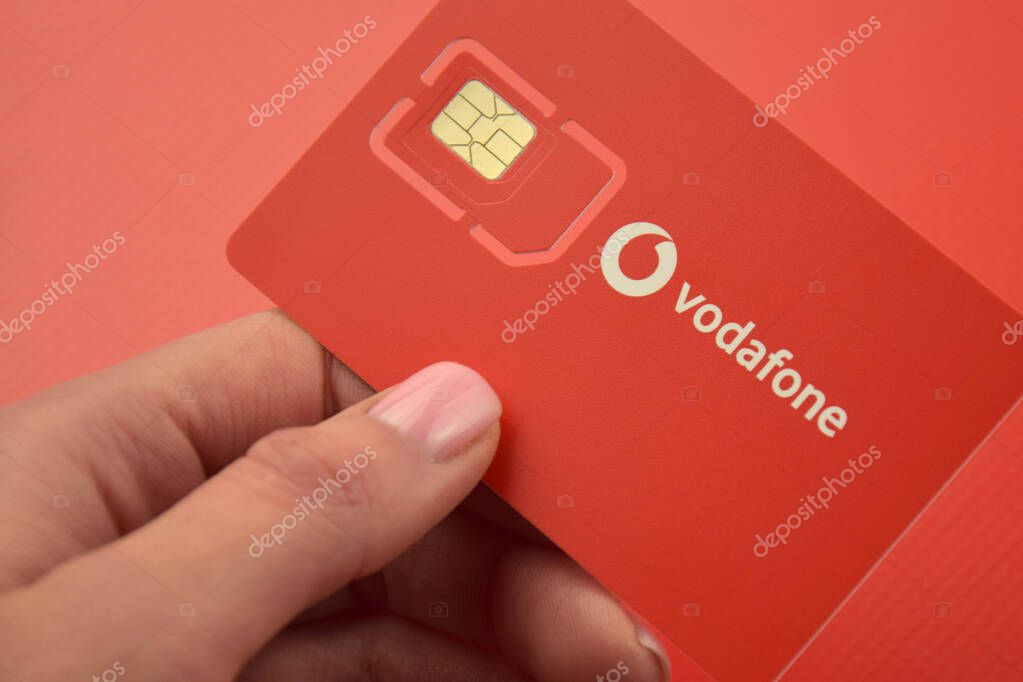 KHARKIV, UKRAINE - FEBRUARY 11, 2023: Vodafone starter pack on a red background.