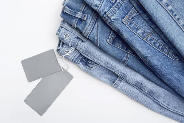 Jede Menge Jeanshosen Einem Stapel Jeans Hintergrund Das Konzept Des — Stockfoto