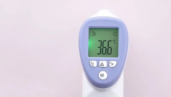 stock image Non-contact digital medical infrared forehead thermometer for temperature measurement, for coronavirus, COVID-19 testing.