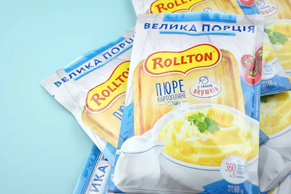 stock image KHARKIV, UKRAINE - FEBRUARY 12, 2023: Rollton instant mashed potatoes on a blue background. Fast food, junk food.