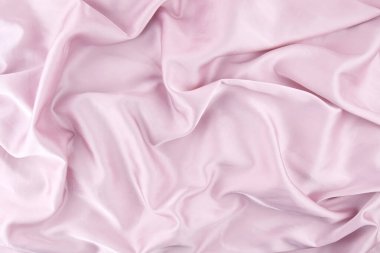 Arka plan için pembe şifon kumaş dokusu. İpek kumaş. Seçici odak.